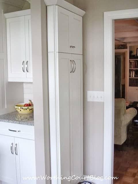 Narrow kitchen cabinet command center added to end of a bank of cabinets