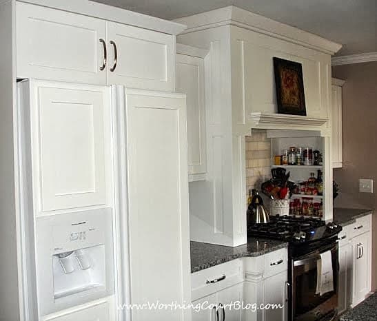 Custom kitchen range hood with built-in spice shelves