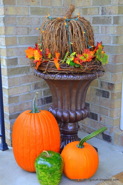 Grapevine pumpkin nestled in an urn