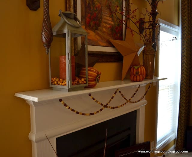 A garland made from wooden beads strung on fishing line is a perfect addition to a Fall mantle