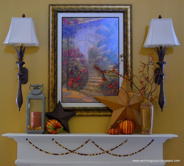 A mantle filled with Fall decorations