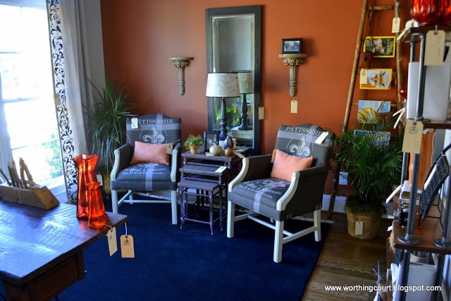 accent wall and ladder used as a magazine rack in this office via Worthing Court blog