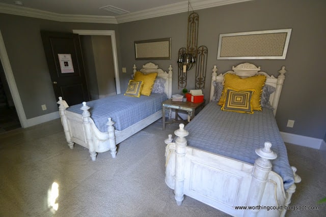 twin beds, yellow and gray bedroom, framed fabric, pillows and light fixture via Worthing Court blog