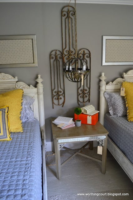 yellow and gray bedroom, orb light fixture, vintage metall wall art via Worthing Court blog