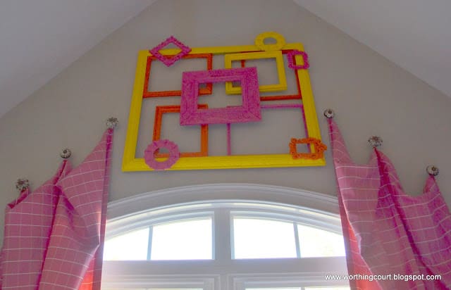 painted frames layered on the wall via Worthing Court blog