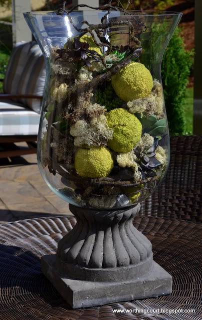Urn filled with natural elements via Worthing Court blog