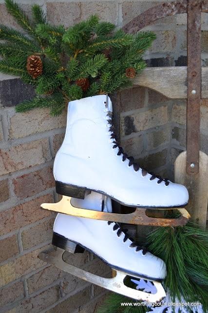 Paint old black skates white for displaying on a winter front porch