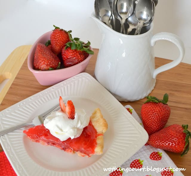 Strawberry pie on a white plate.