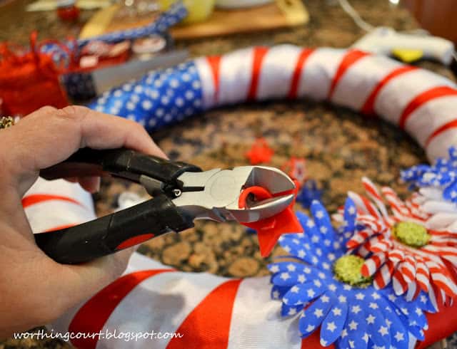 Gluing the stars onto the wreath.