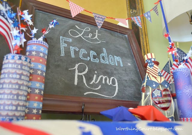 The chalkboard is by the decorated bottles.