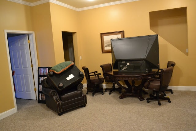 A room with chairs and a TV.