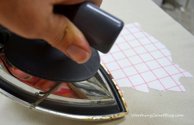 Use the tip of your iron to go all around the edges of the transfer paper