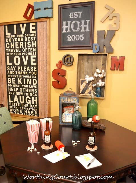 Gallery Wall and Game Table with popcorn and beer.