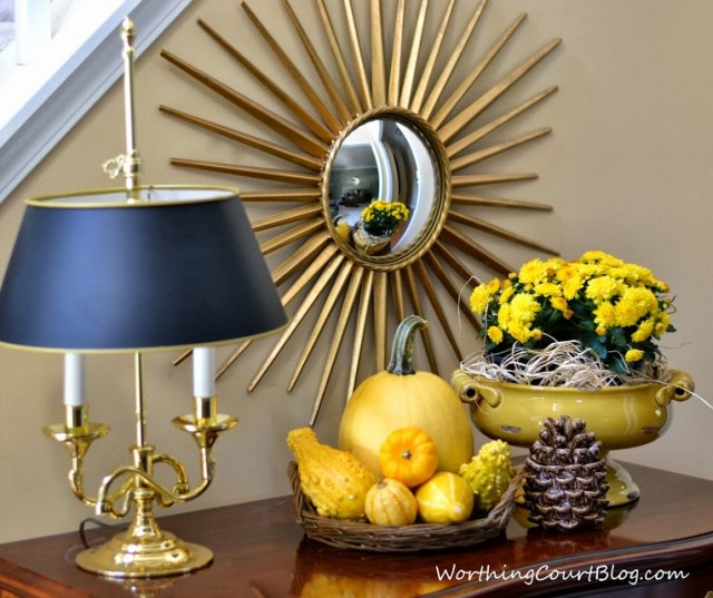 Worthing Court: fall foyer vignette with yellow pumpkins, gourds and mums