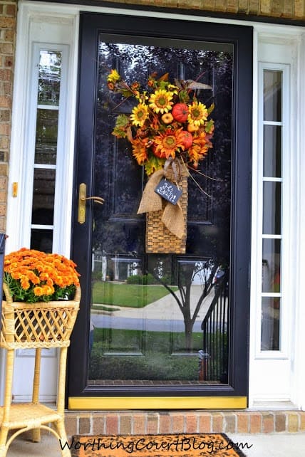 Worthing Court: Front door arrangement with fall florals embellished with burlap ribbon and a mini chalkboard