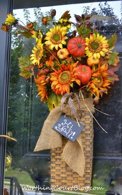 Worthing Court: Front door arrangement with fall florals embellished with burlap ribbon and a mini chalkboard