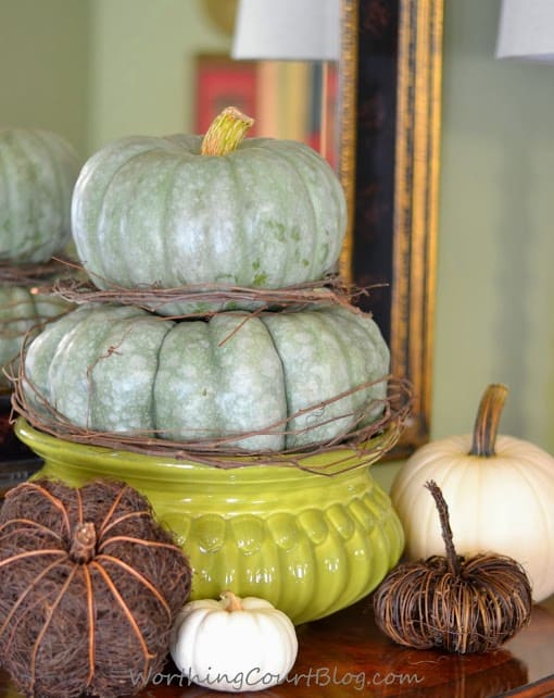 Worthing Court: Fall vignette with an heirloom pumpkin topiary mixed with white and twiggy pumpkins