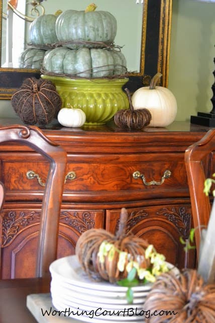 Worthing Court: Fall vignette with an heirloom pumpkin topiary mixed with white and twiggy pumpkins