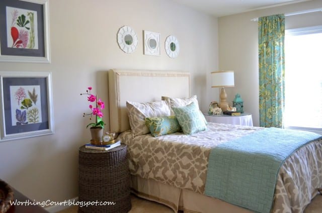 Worthing Court: Guest bedroom with calendar art, upside-down wicker hamper nightstand and calendar art