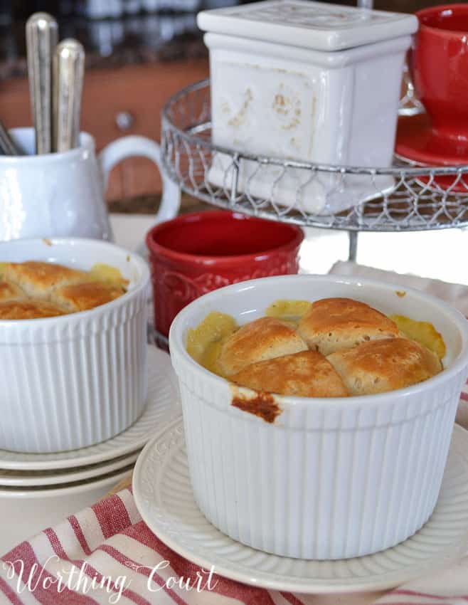 The baked pot pies in white dishes.