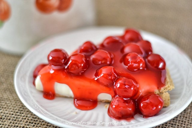 The cherry pie on a white plate.