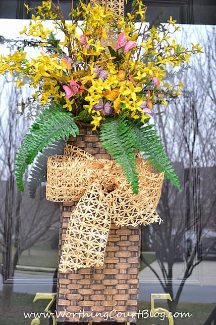 Nothing announces the arrival of spring more than when forsythia begins to bloom. Instead of a traditional wreath, fill a basket with faux forsythia stems and add a little something for color and greenery. Add ribbon to complete the welcoming arrangement. || Worthing Court Blog