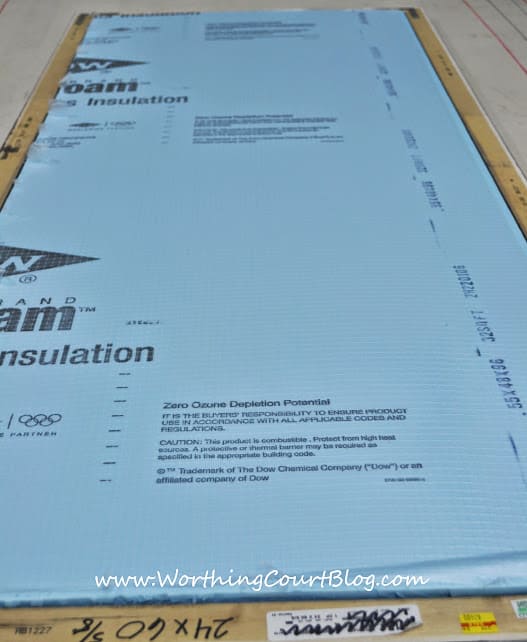 Sheet of exterior insulation cut to fit inside of a frame to be covered with fabric and serve as a bulletin board.