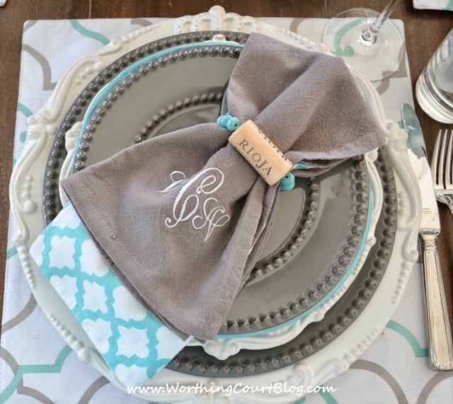 Beautiful and casual turquoise and gray table setting on a round table