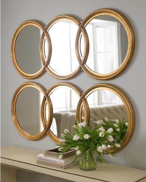 One simple thing room ideas - open up a room with multiple mirrors hanging together
