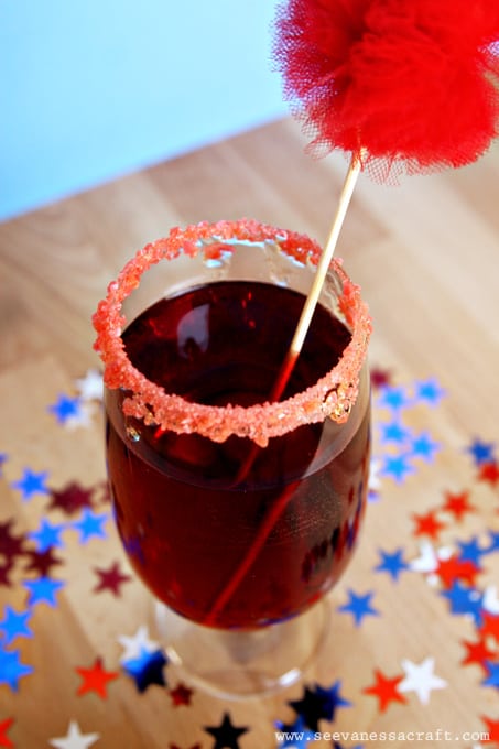 July 4th Recipes - Cranberry Mocktail on the table with stars.
