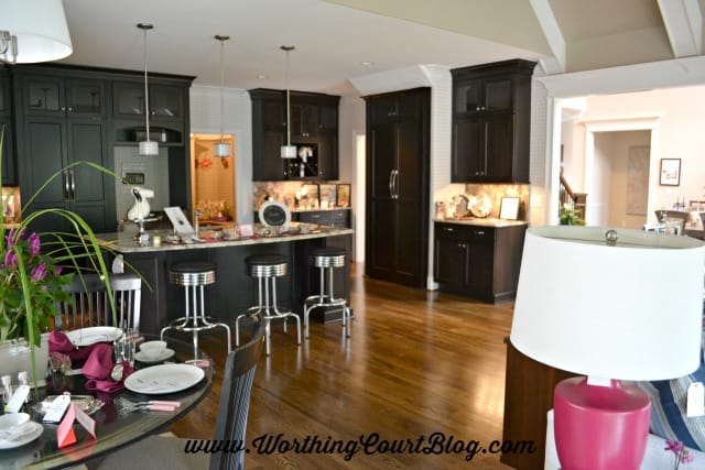 Kitchen with black cabinets decorated with mid-century modern details