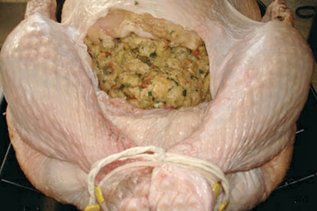Turkey filled with Pepperidge Farm stuffing and legs are tied with string.