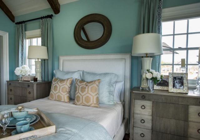 The use of taller chests gives the master bedroom a grand feel