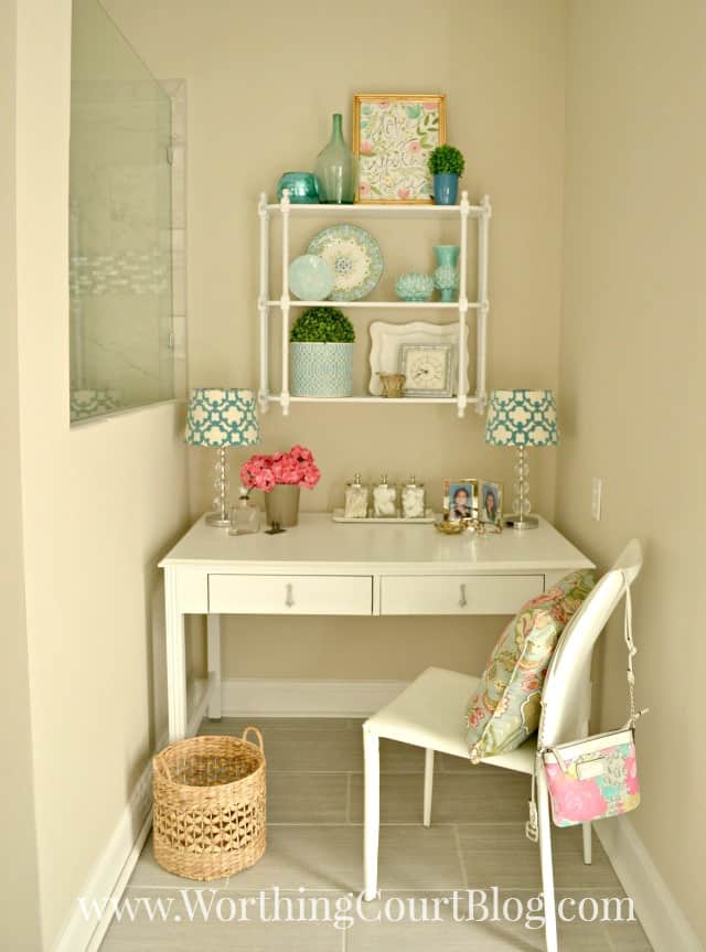 An old desk recyled into a master bathroom dressing table and makeup vanity