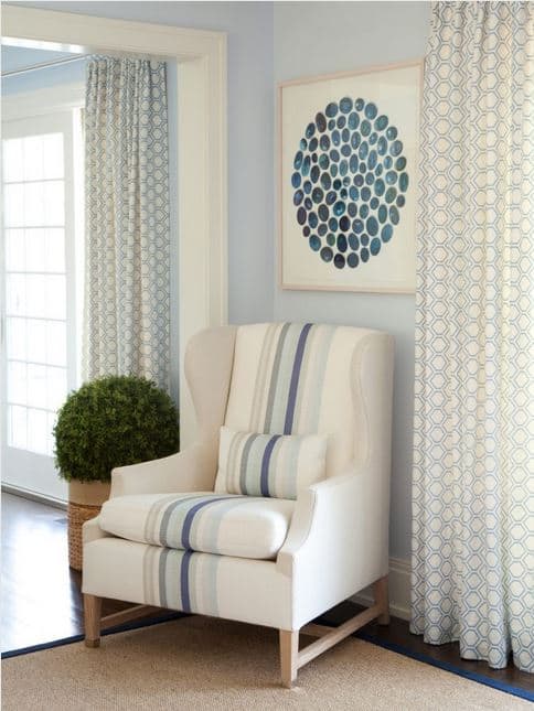 Love the stripes in the chair fabric paired with the pattern in the drapery fabric
