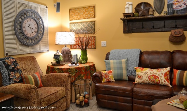 Basement family room decor.  Mixing pattern and colors and using what you already have.