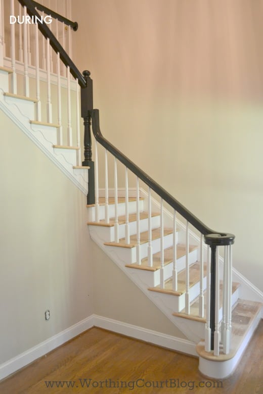 Formerly oak handrail painted black and oak trim painted white