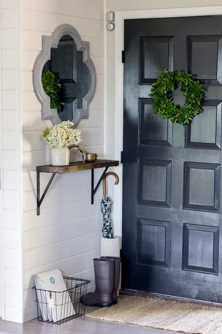 Add a mirror to a small front porch to capture more light.