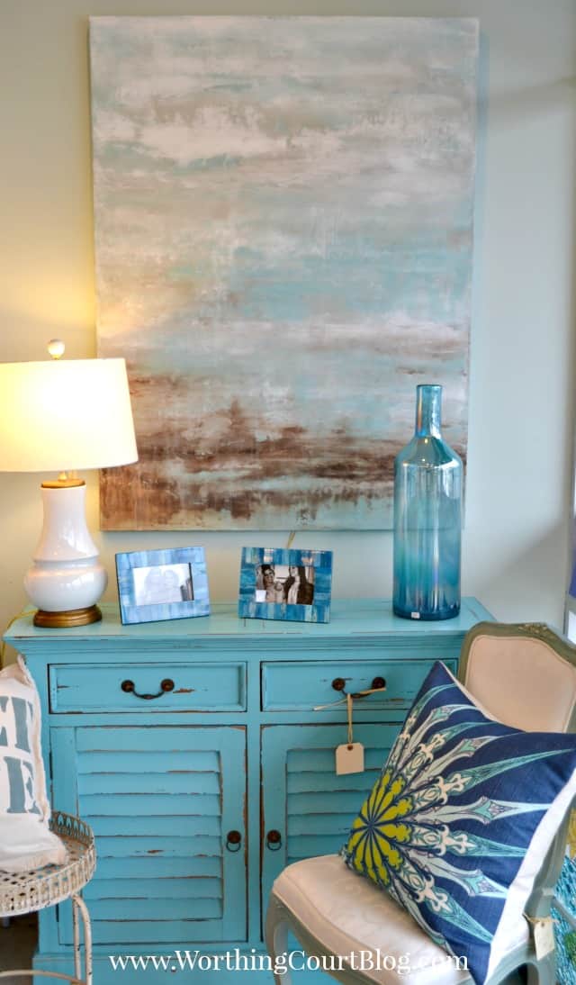 Pretty distressed blue chest with shutter doors and abstract ocean artwork
