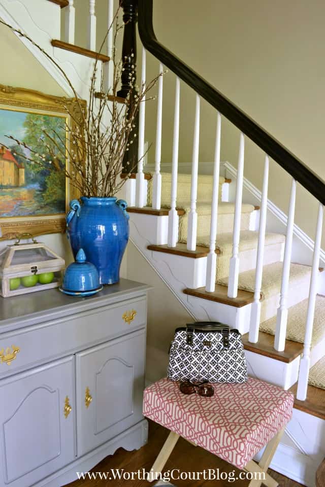 A cute stool adds a bright pop of color