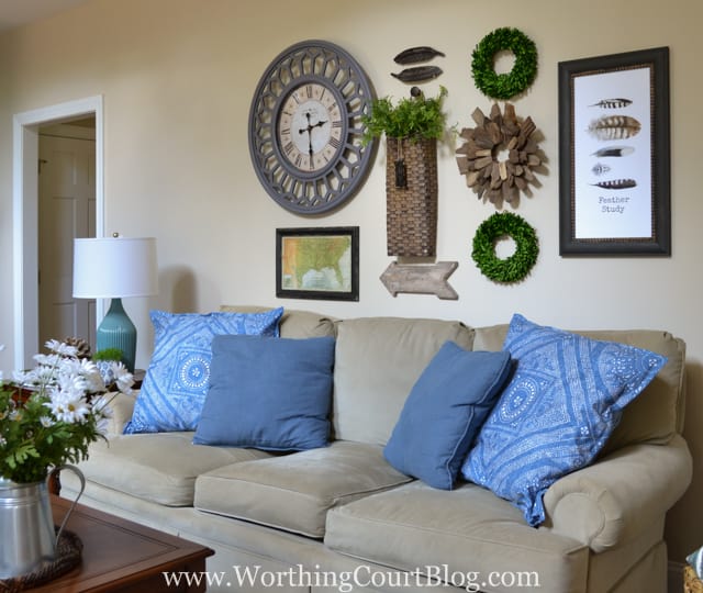 Gallery wall above a sofa with rustic farmhouse touches