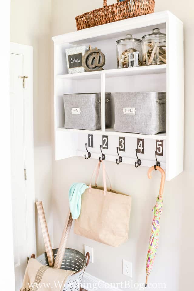 No mudroom? No problem. Repurpose the top of an old hutch into a dropzone.