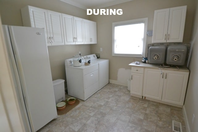 A kitchen with a sink and a refrigerator