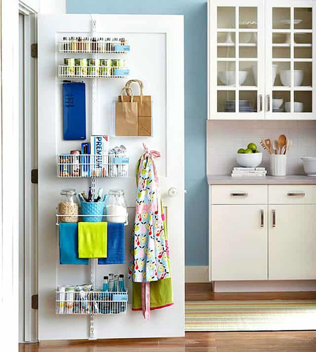 Store kitchen supplies on the inside of a pantry door by using an adjustable shelf strip