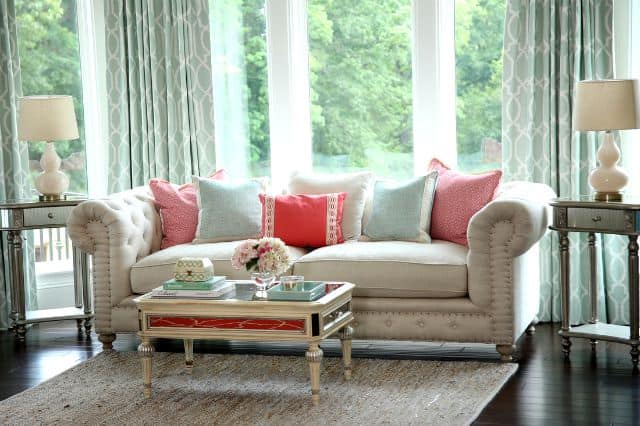 Neutral sofa with subdued pops of color by Colordrunk Designs