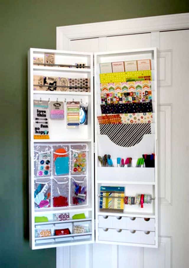 Use an over the door hanging armoire to store craft and scrapbook supplies