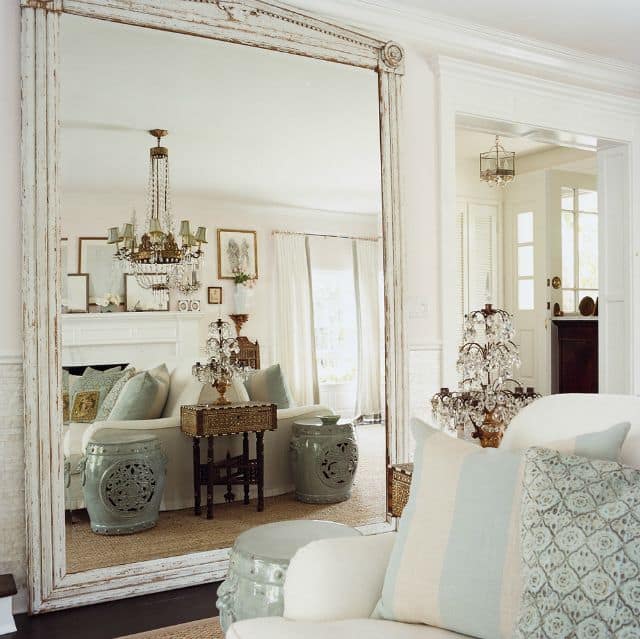 A floor mirror leaning against the wall only takes up a few inches of space, but can make a room feel dramatically larger.