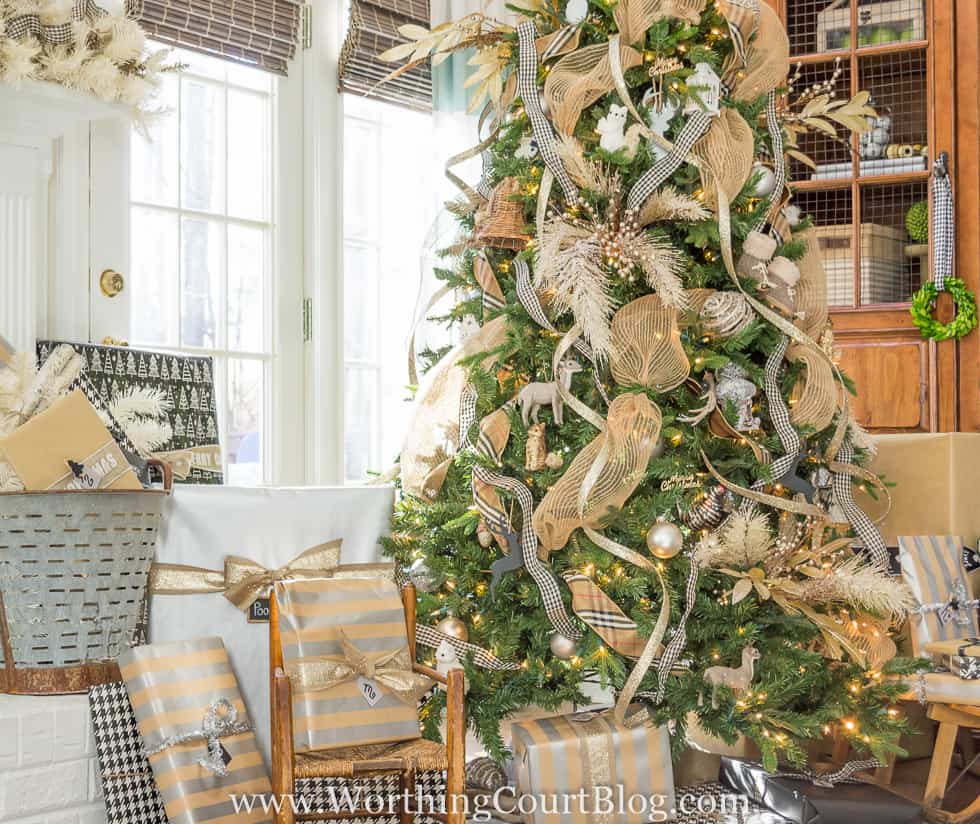 Rustic luxe Christmas tree with a variety of ribbons and ornaments.