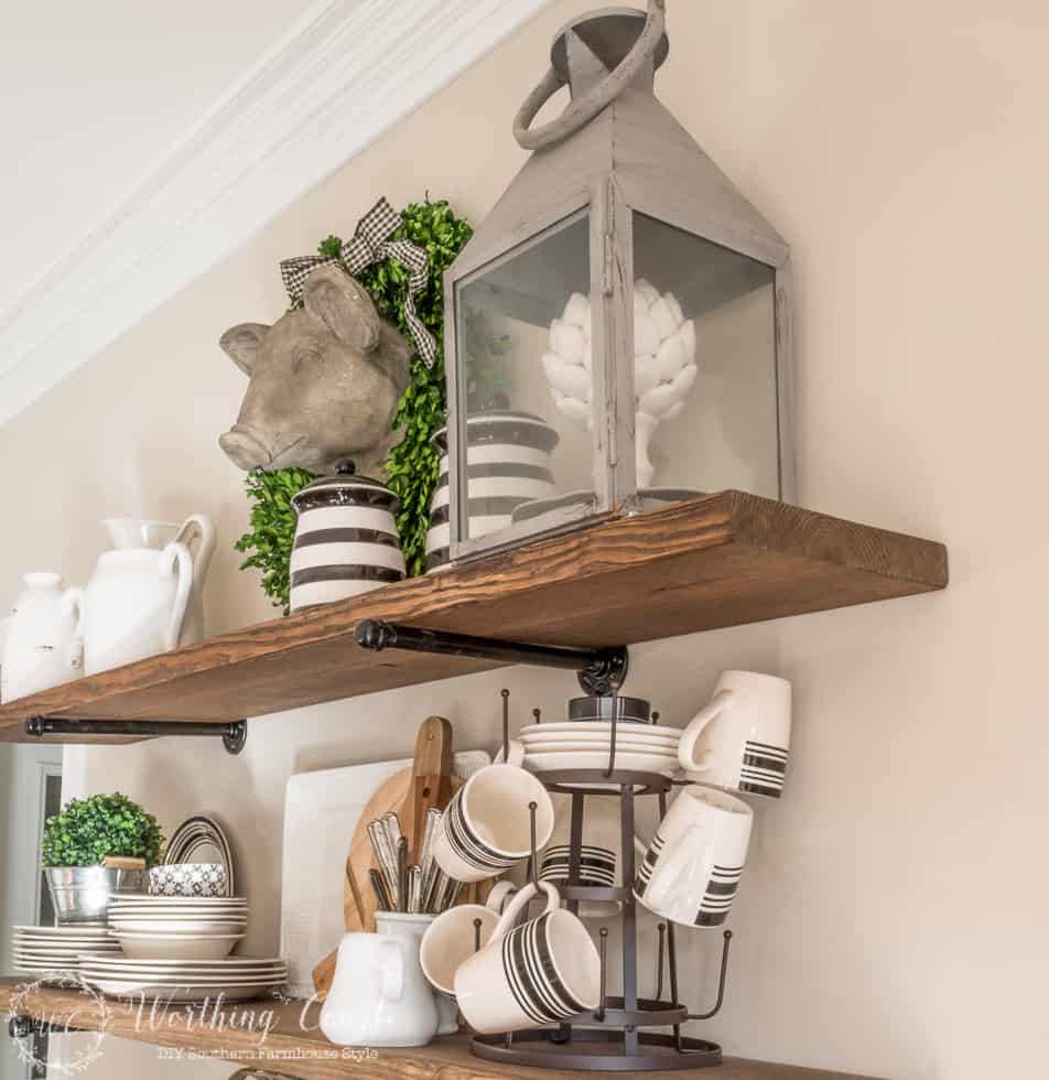 DIY rustic farmhouse kitchen shelves display with cups and saucers.