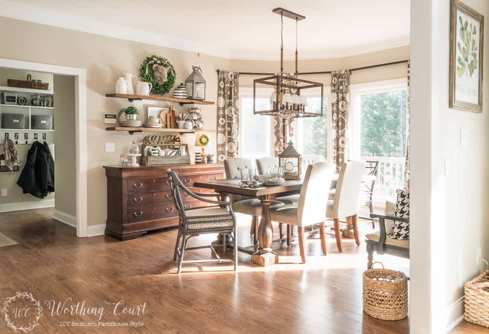 There is a small basket on the floor by the entrance to the dining room.